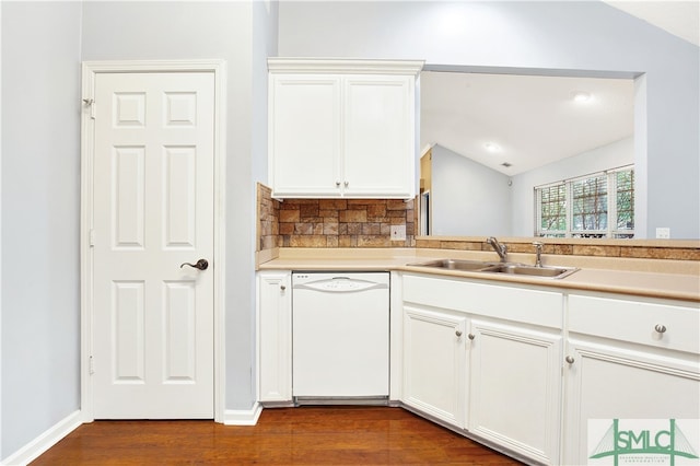 kitchen featuring sink, vaulted ceiling, dishwasher, and white cabinets