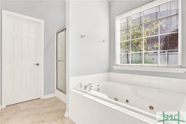 bathroom with tile patterned floors and separate shower and tub