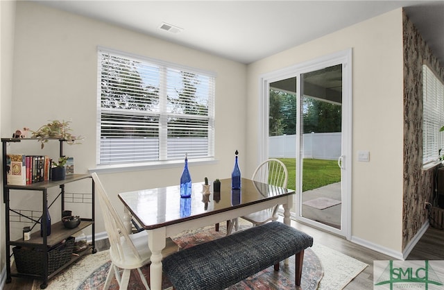 dining space featuring hardwood / wood-style floors