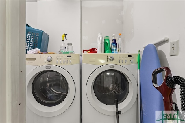 laundry area with independent washer and dryer