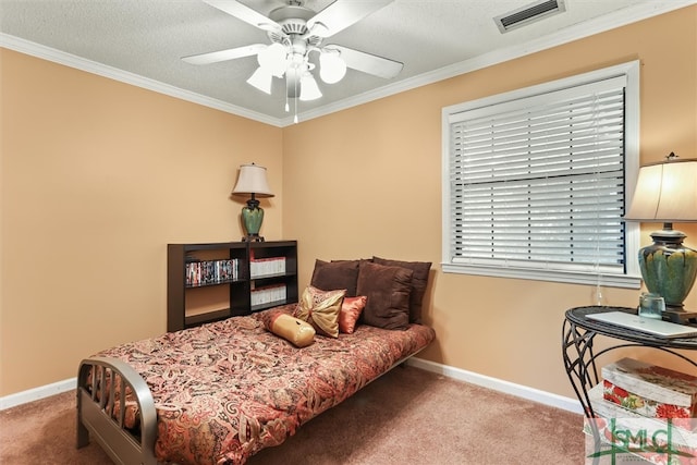 carpeted bedroom featuring a textured ceiling, ceiling fan, and ornamental molding