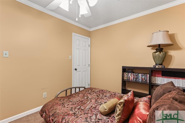 carpeted bedroom with a textured ceiling, ceiling fan, and crown molding