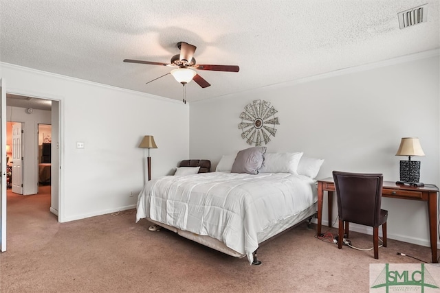 carpeted bedroom featuring a textured ceiling, ceiling fan, and crown molding