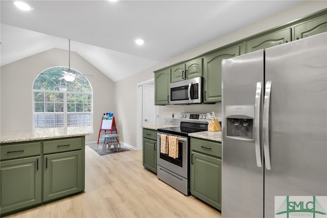 kitchen with green cabinetry, vaulted ceiling, appliances with stainless steel finishes, light hardwood / wood-style floors, and ceiling fan