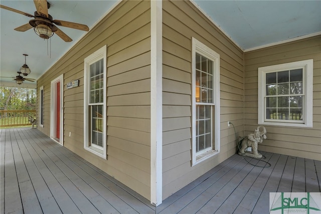 wooden terrace featuring ceiling fan