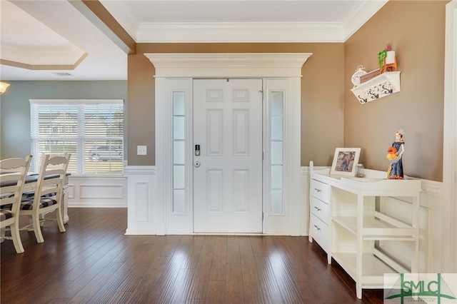 entryway featuring ornamental molding and dark hardwood / wood-style flooring