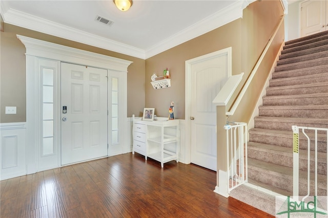 entryway featuring dark wood-type flooring and crown molding