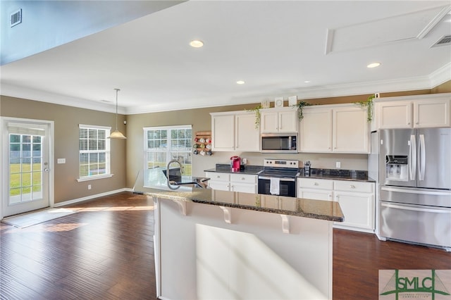 kitchen with white cabinetry, stainless steel appliances, and dark hardwood / wood-style flooring