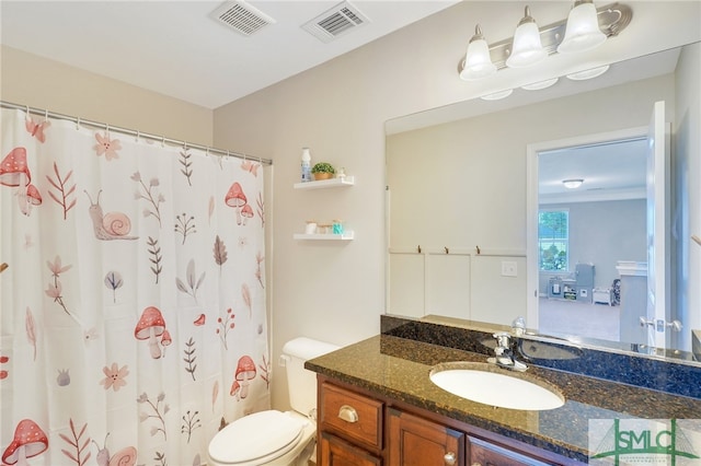 bathroom featuring vanity, curtained shower, and toilet