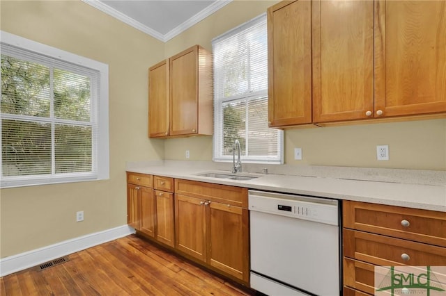 124 Brady St, Savannah, GA 31401 - kitchen featuring dishwasher, a sink, crown molding, wood finished floors, and light countertops