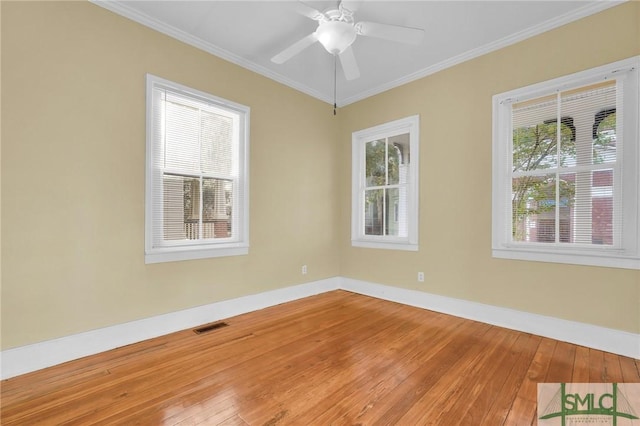 124 Brady St, Savannah, GA 31401 - empty room featuring hardwood / wood-style flooring, plenty of natural light, baseboards, and crown molding