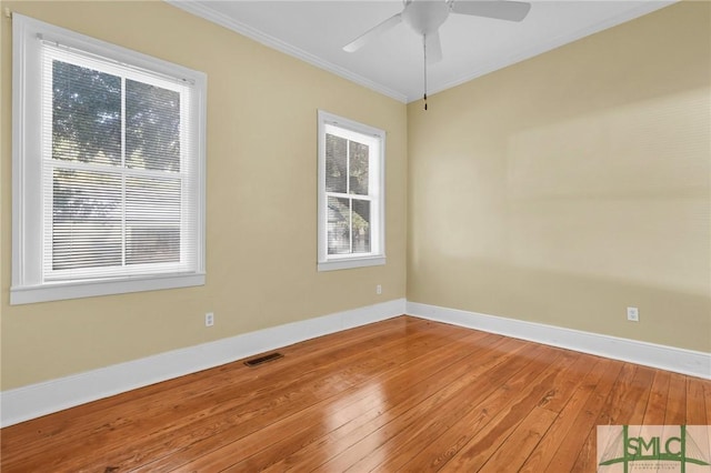 124 Brady St, Savannah, GA 31401 - empty room with hardwood / wood-style flooring, baseboards, ornamental molding, and ceiling fan