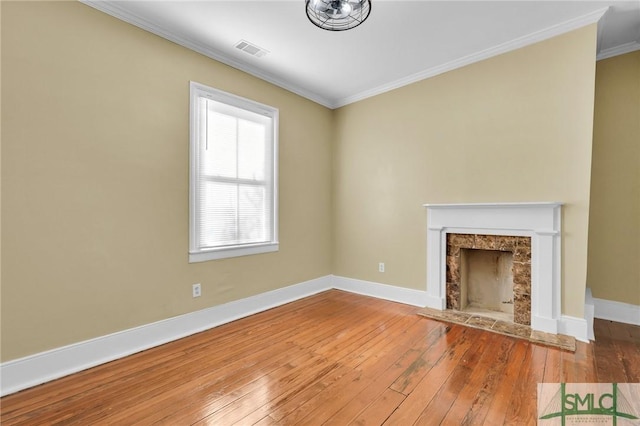 124 Brady St, Savannah, GA 31401 - unfurnished living room featuring crown molding, a fireplace, wood-type flooring, and baseboards