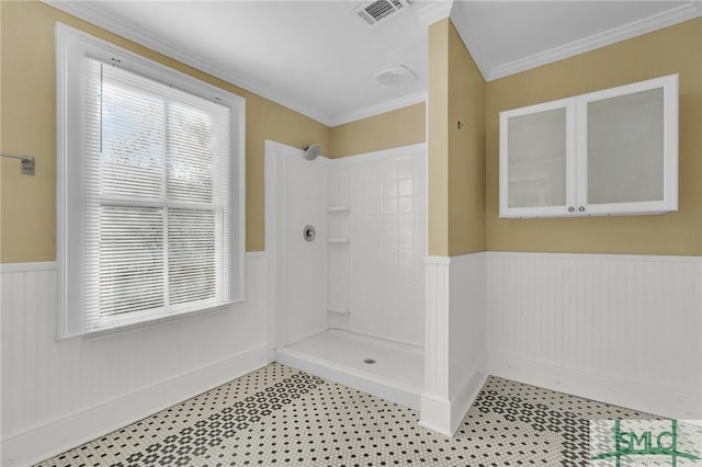 124 Brady St, Savannah, GA 31401 - bathroom featuring tile patterned floors, a wainscoted wall, a shower, healthy amount of natural light, and crown molding