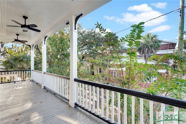 wooden terrace featuring ceiling fan