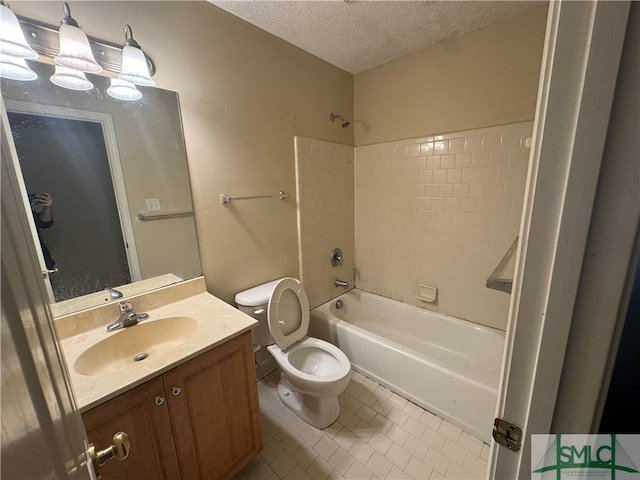 full bathroom featuring a textured ceiling, toilet, vanity, tiled shower / bath combo, and tile patterned flooring