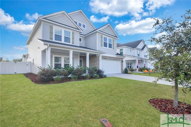 view of front of house featuring a garage and a front lawn