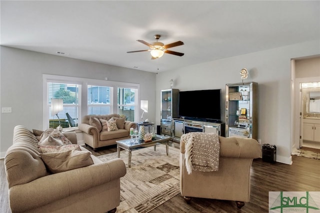 living room with hardwood / wood-style floors and ceiling fan