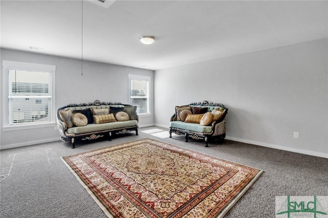 sitting room featuring carpet flooring and a healthy amount of sunlight