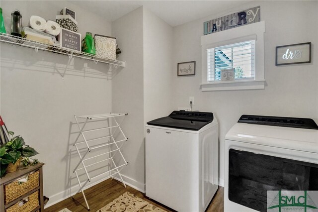 laundry room featuring wood-type flooring and washing machine and dryer