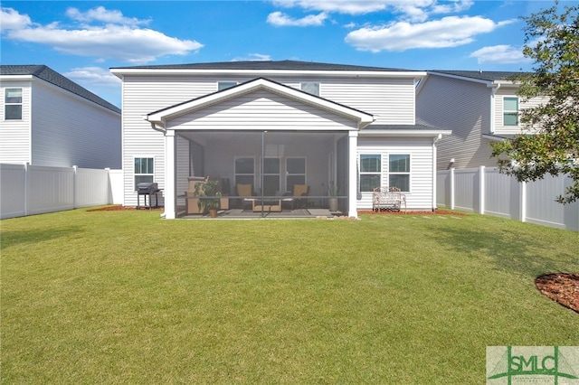 back of property featuring a yard and a sunroom