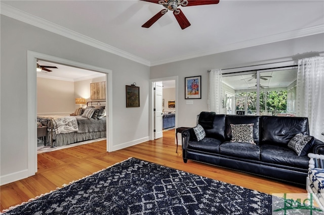 living room with crown molding, hardwood / wood-style flooring, and ceiling fan