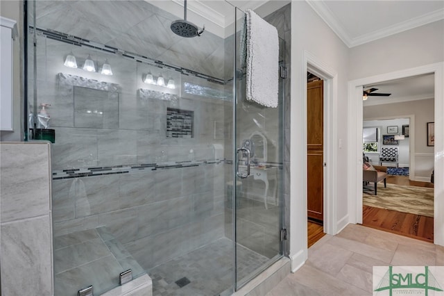 bathroom featuring ceiling fan, hardwood / wood-style flooring, crown molding, and an enclosed shower