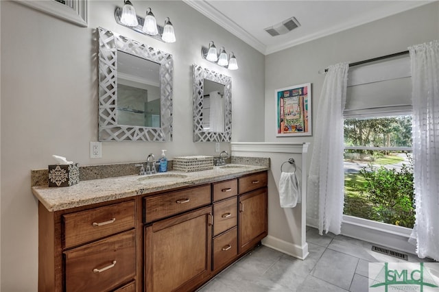 bathroom featuring vanity, tile patterned floors, and ornamental molding