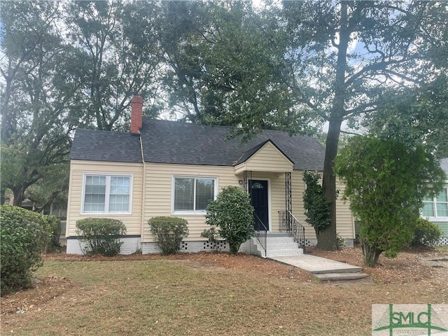 202 Forrest Ave, Savannah, GA 31404 - view of front of property featuring a chimney, roof with shingles, and a front yard