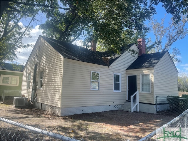 view of front of home with cooling unit