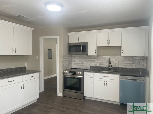 kitchen with white cabinetry, stainless steel appliances, and sink