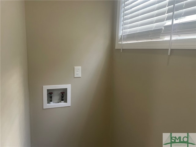 clothes washing area featuring washer hookup