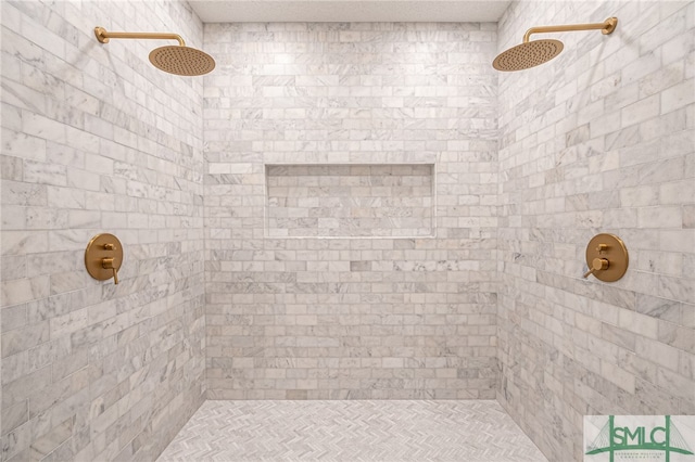 bathroom with a tile shower