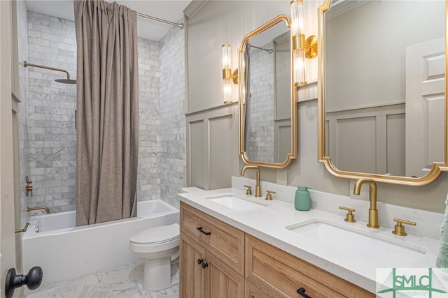 full bathroom featuring shower / bath combo with shower curtain, vanity, and toilet