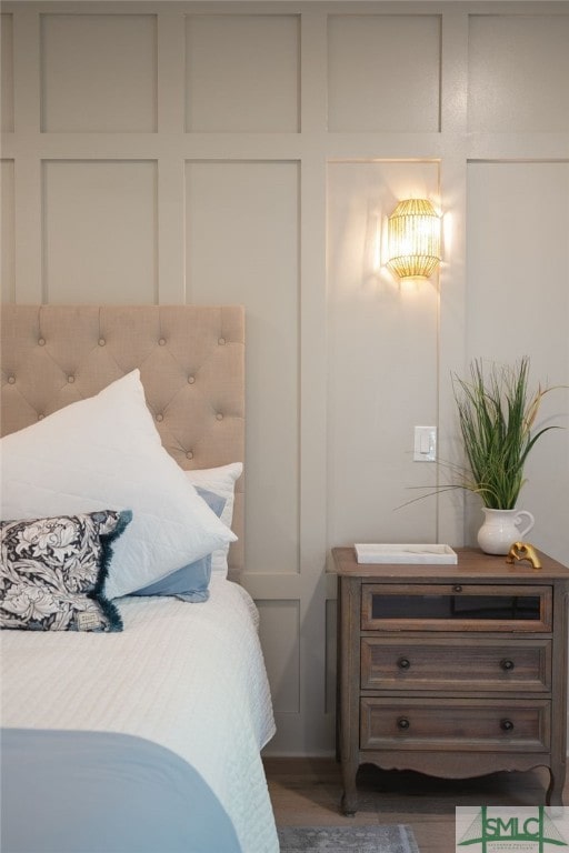 bedroom with dark wood-type flooring