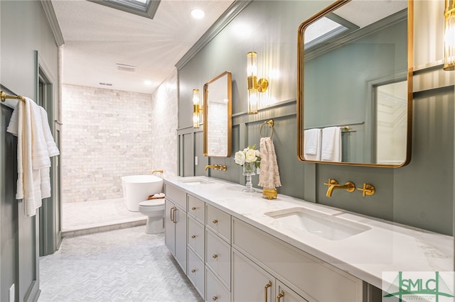 bathroom featuring a bathtub, ornamental molding, vanity, tile walls, and toilet