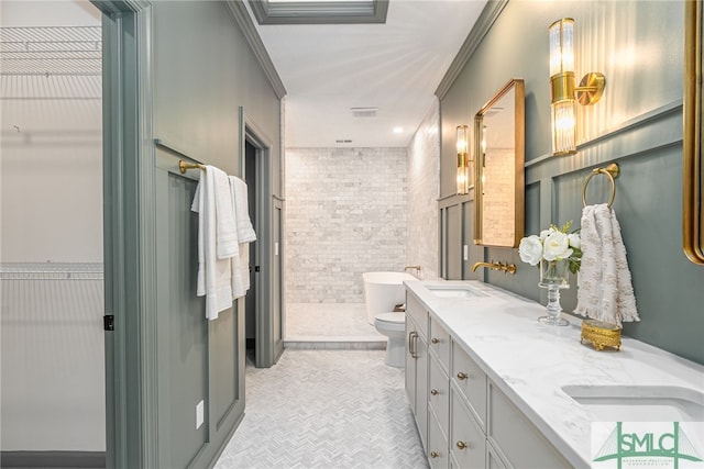 bathroom with vanity, ornamental molding, tile walls, and toilet