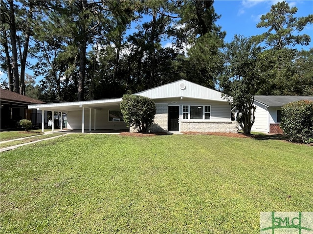 single story home with a front lawn and a carport