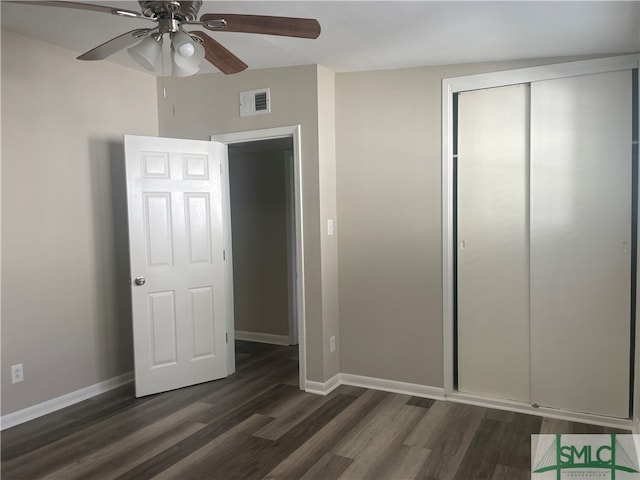 unfurnished bedroom with a closet, ceiling fan, and dark hardwood / wood-style flooring