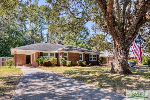 single story home featuring a front yard and a carport