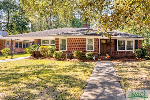 ranch-style home with a front yard