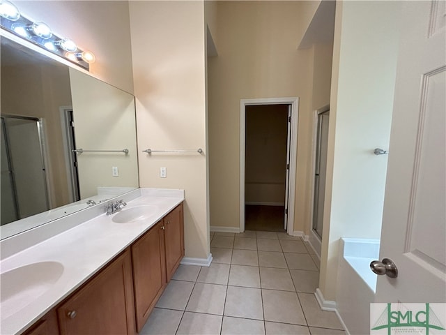 bathroom featuring vanity, shower with separate bathtub, and tile patterned flooring