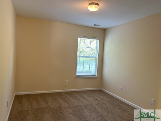 unfurnished room featuring carpet flooring