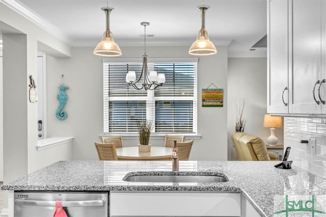 kitchen with white cabinetry, decorative backsplash, dishwasher, and ornamental molding