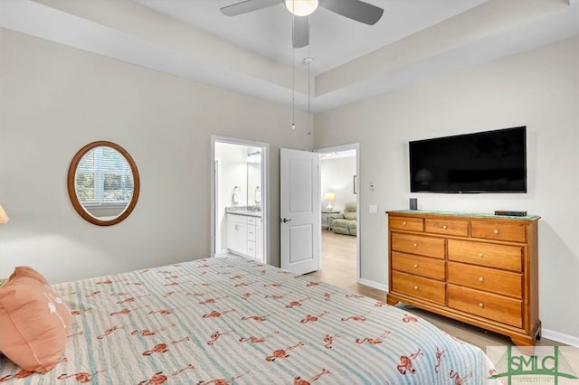 bedroom featuring connected bathroom and ceiling fan