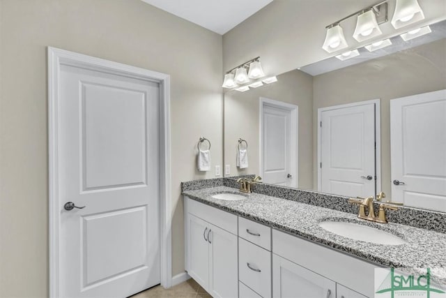 bathroom with vanity and tile patterned floors