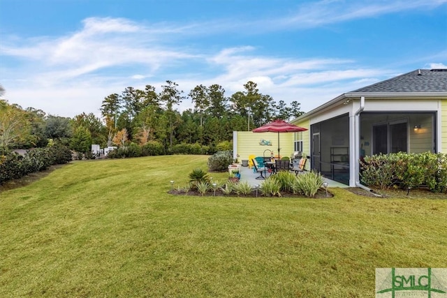 view of yard featuring a patio and a sunroom