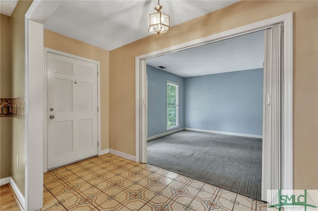 entryway with light carpet