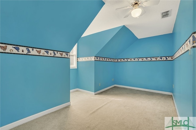 bonus room with light carpet and ceiling fan