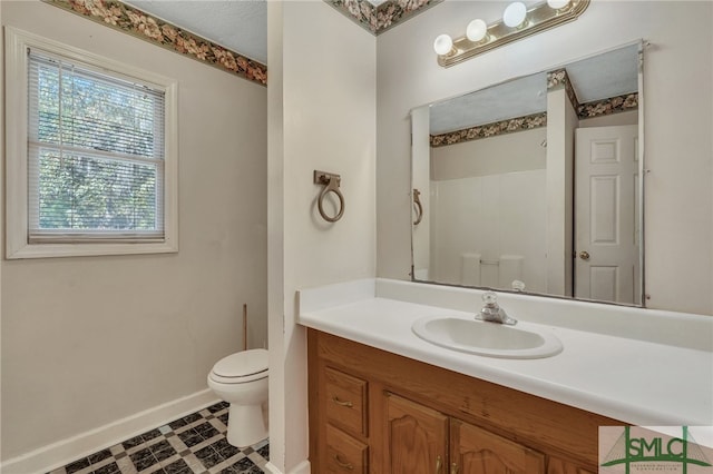 bathroom featuring vanity and toilet